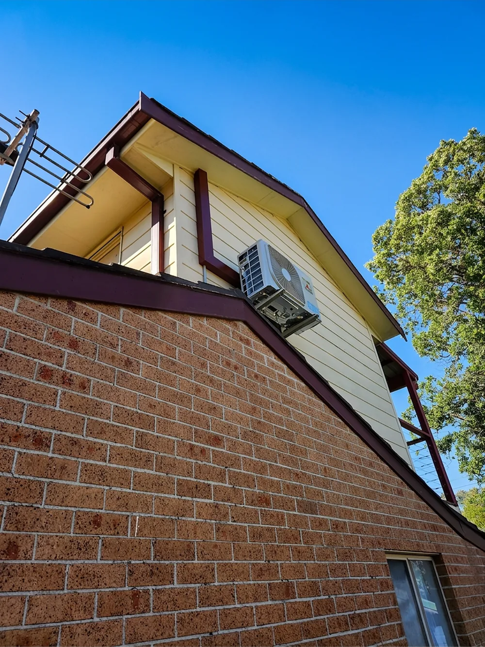 Split-system air conditioner unit installed on the exterior of a home